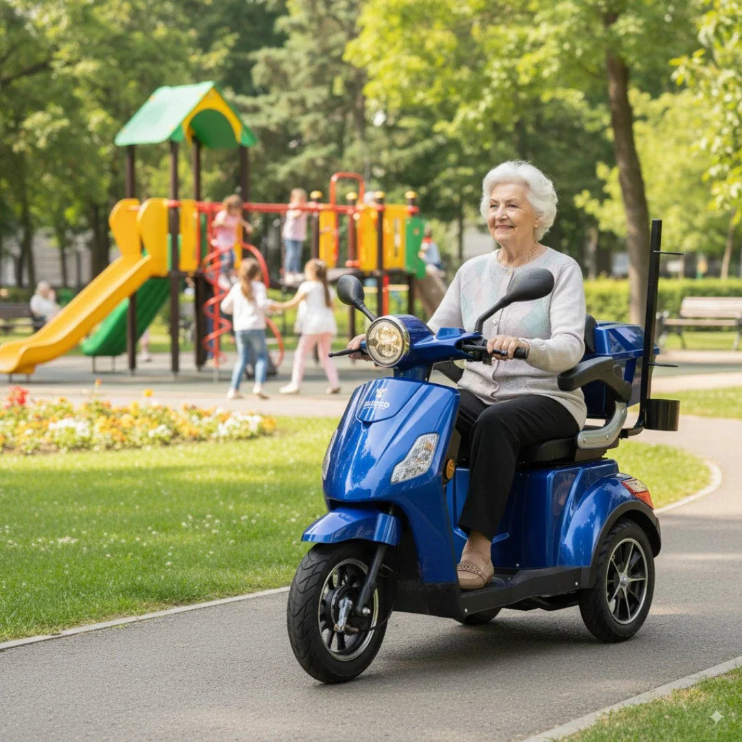Plavi električni skuter Veleco Draco na tri kotača s gospođom u vožnji parkom