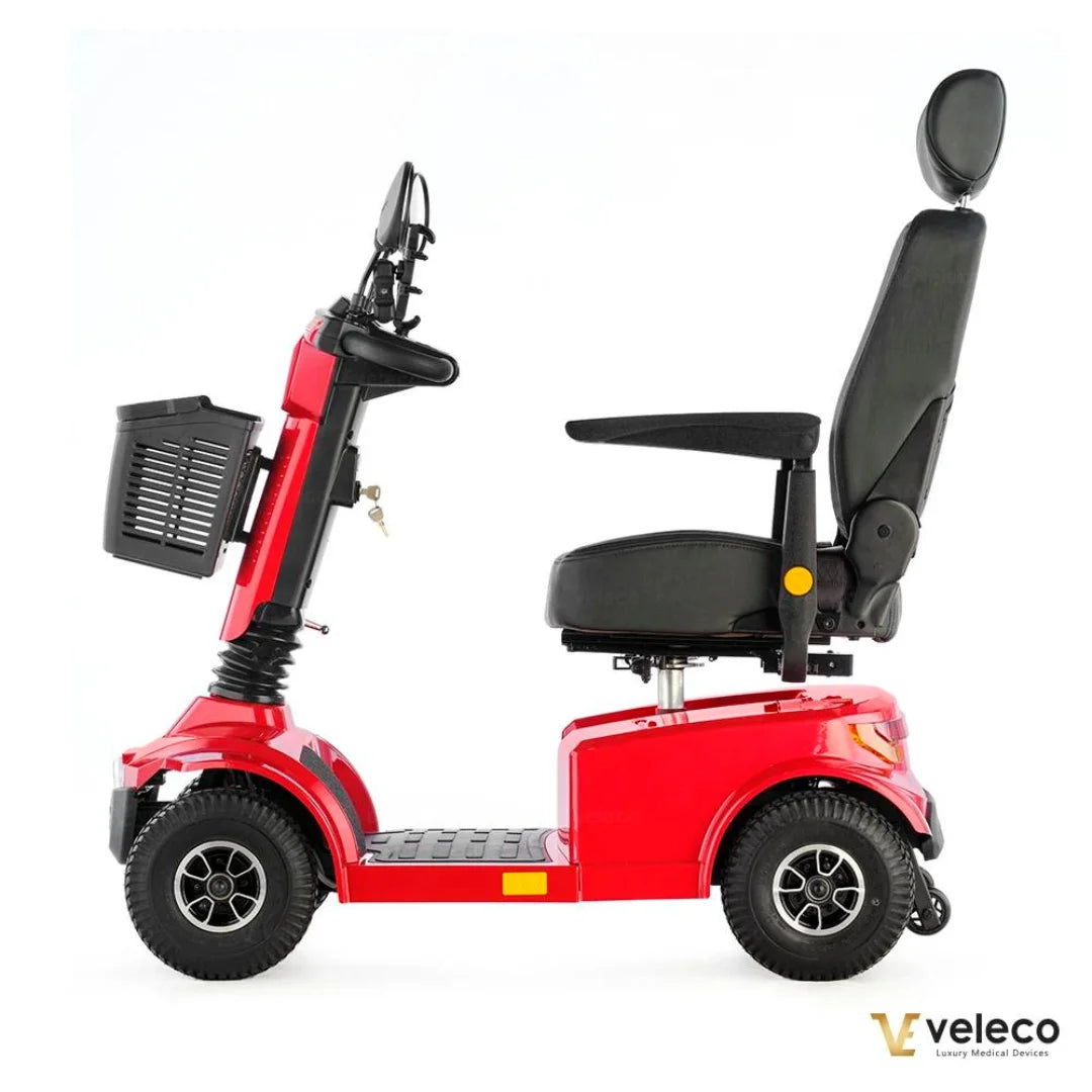 Crveni električni skuter za starije osobe Veleco Jumpy, pogled s bočne strane s košarom i sjedalom