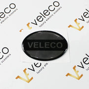 Crna ovalna naljepnica s logotipom Veleco za kutiju za zaključavanje skutera Faster
