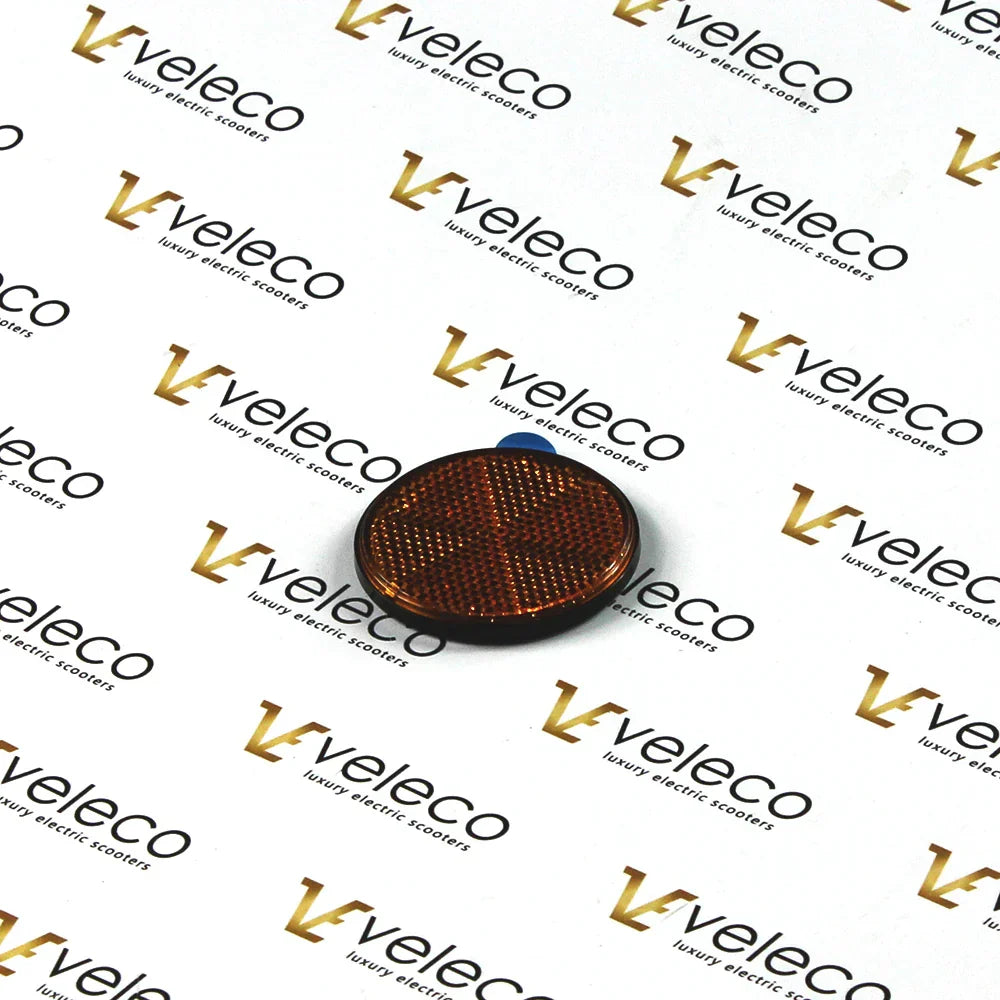 Narančasti katadiopter za električni skuter Veleco Cosmo na bijeloj podlozi s logotipom